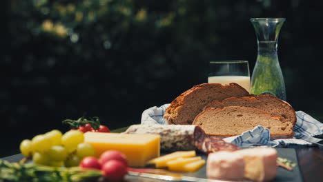 indulge in a picnic paradise with a delightful assortment of snacks on an inviting garden table. a feast for the senses.  great for food vlogs, recipe videos, and appetizing product presentations