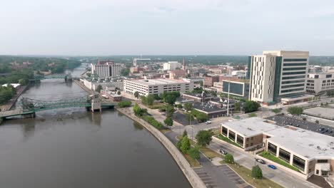 Downtown-Joliet,-Illinois-along-the-Des-Plaines-River-with-drone-video-moving-up