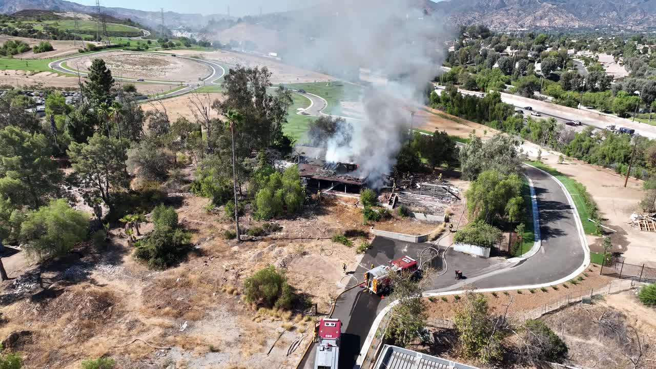 Firefighters Battle Structure Fire - Aerial View