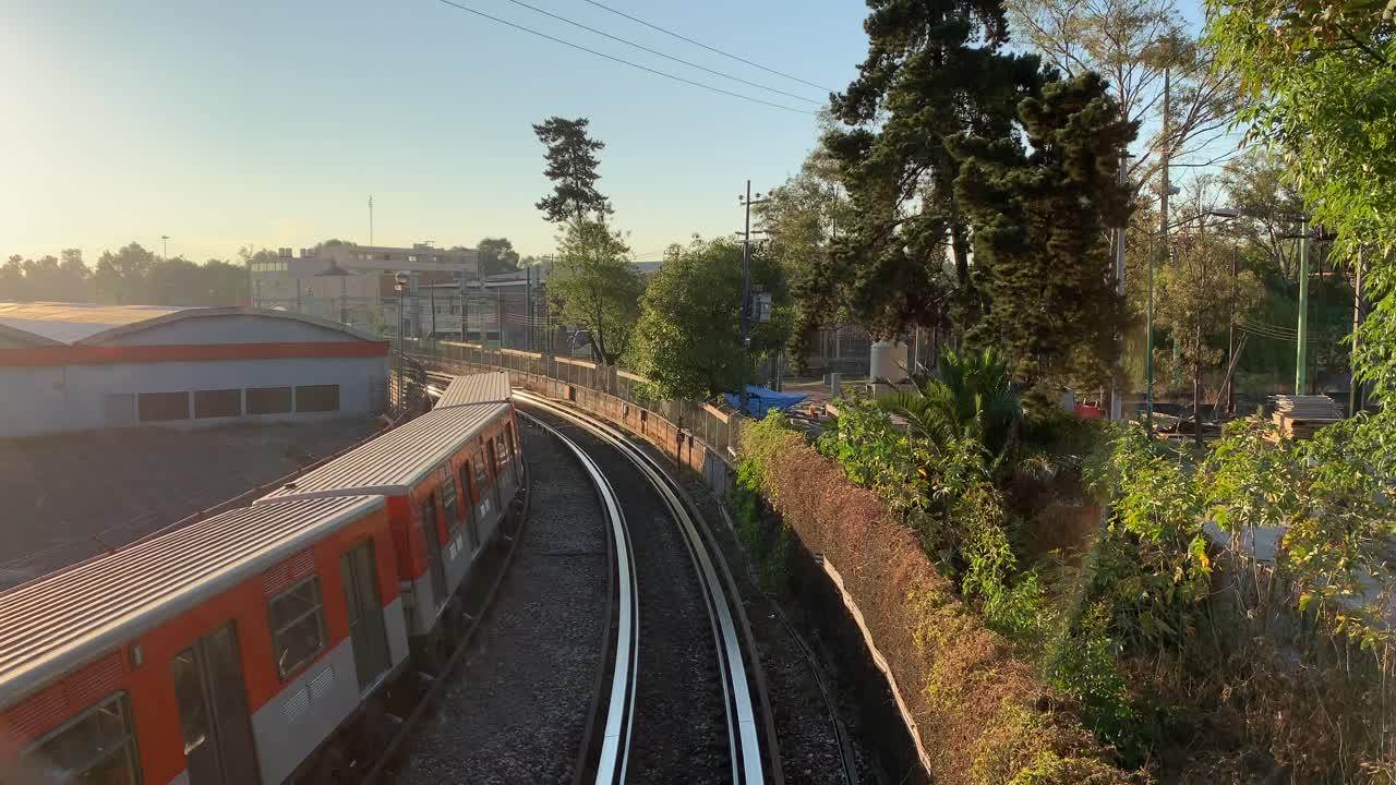 Elevated trains on their morning commute alongside Tlalpan Avenue in the southern part of Mexico City, Mexico