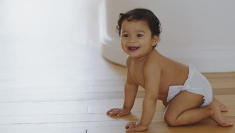 happy-baby-girl-crawling-on-floor-toddler-exploring-home-curious-infant-having-fun-enjoying-childhood