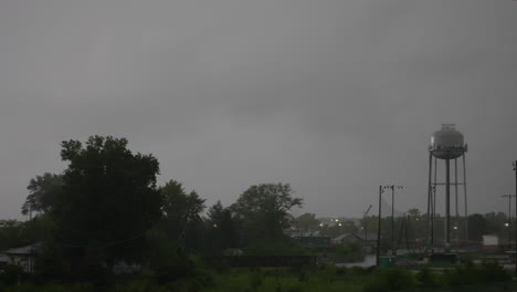 Timelapse-of-a-water-tower-and-creek-in-a-thunder-storm