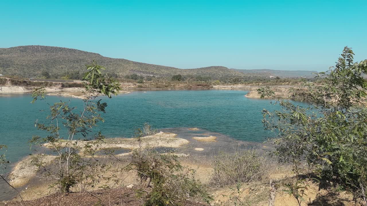 A beautiful blue lake at the bottom of the mountain