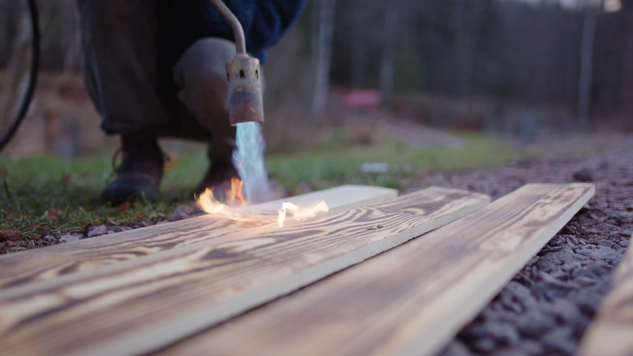 LPG blowtorch used to char planks in traditional Japanese Yakisugi technique