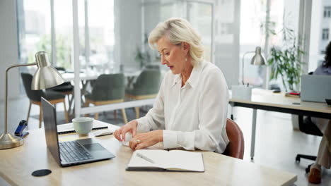 woman sneezing in office