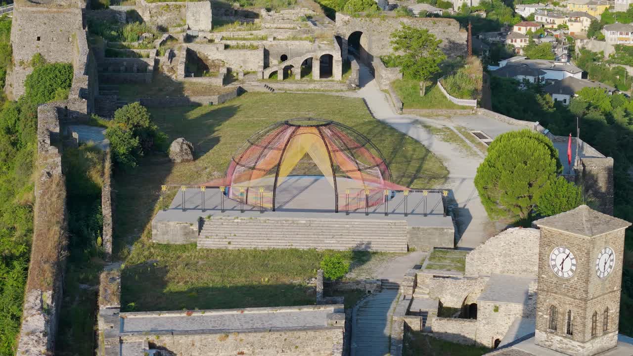 Castle of Gjirokastra in Albania. Beautiful drone reveal of historical landmark site and landscape.