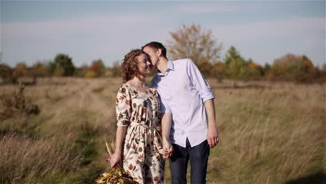 couple in love sharing meadow hug