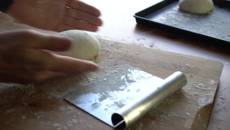 Chef-preparing-dough-for-pizza,-croissants-or-bread