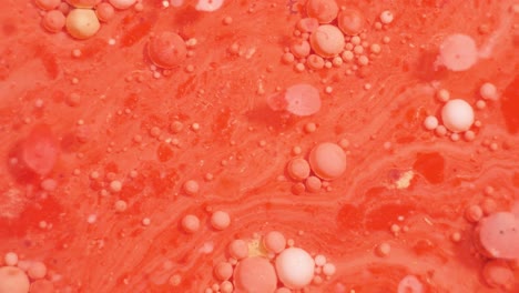 abstract red and orange liquid texture with bubbles