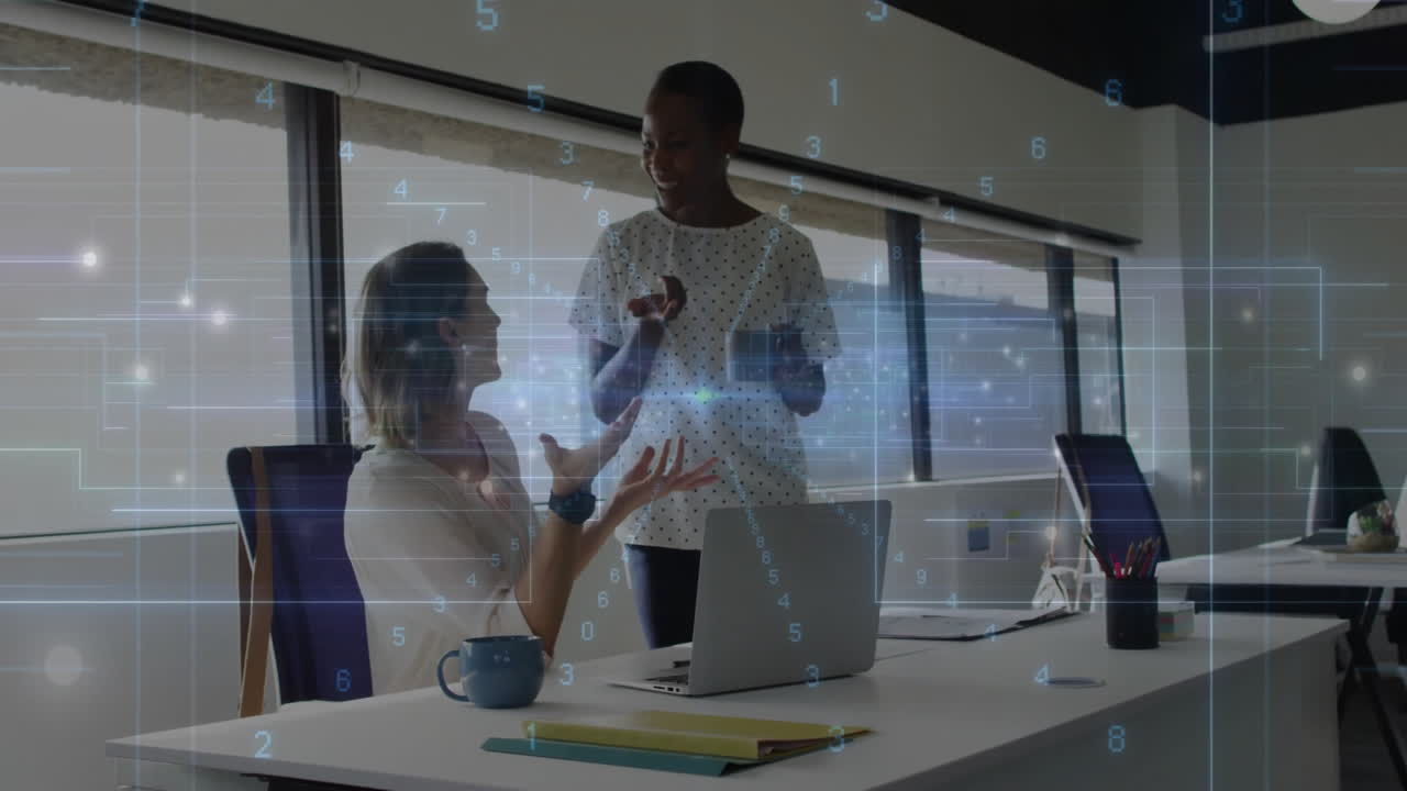 Two colleagues discussing at office with digital data overlay animation