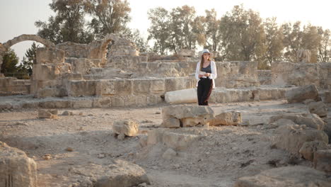 woman exploring ancient ruins