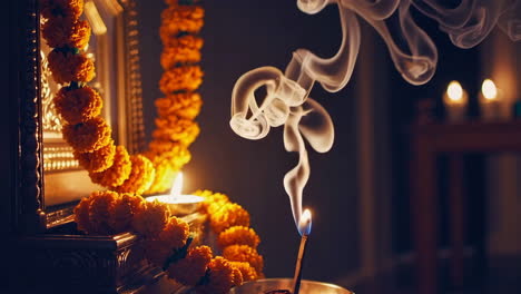 incense smoke and marigold garland in a spiritual prayer setting