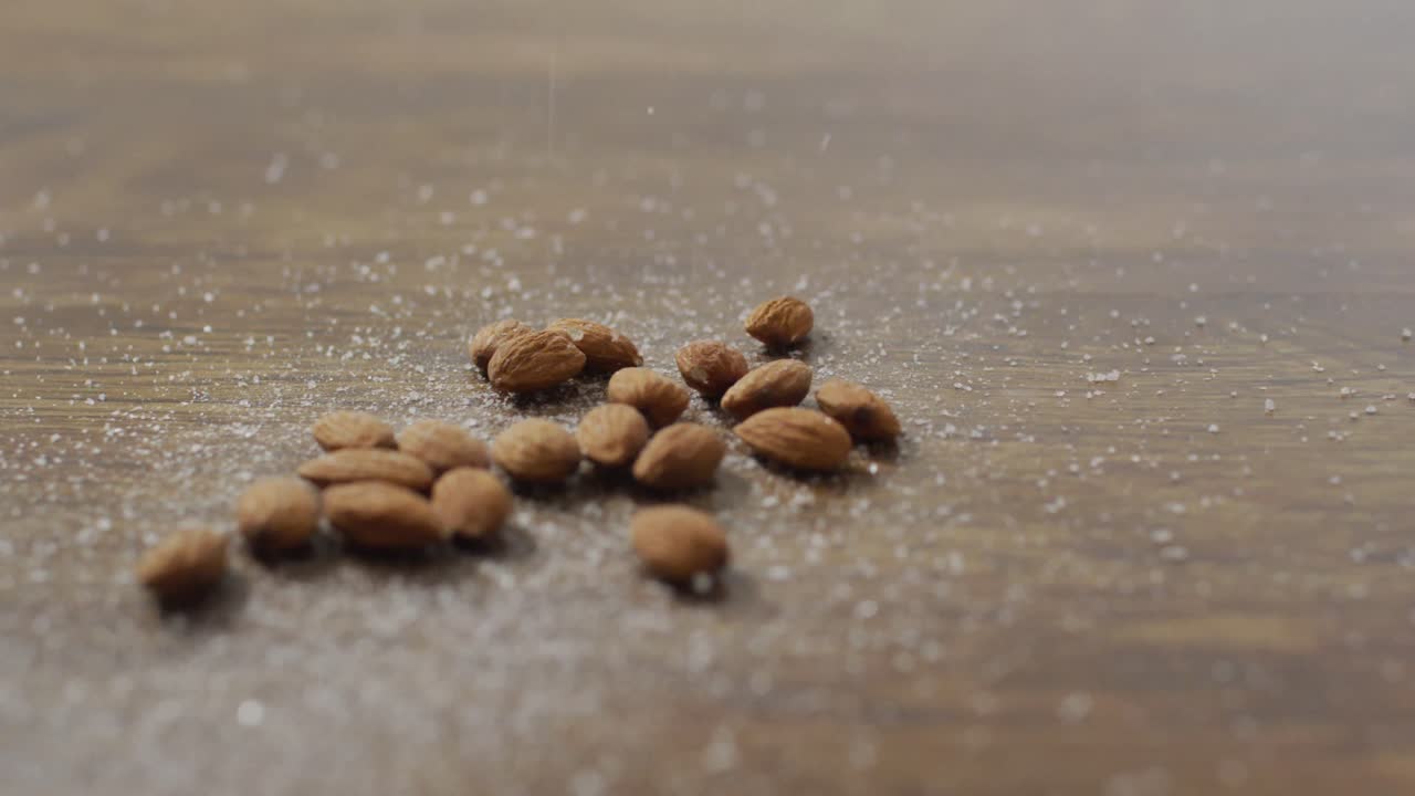 Video of almonds on wooden background