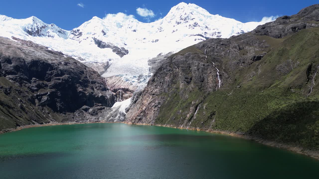 Flyover Rajucolta Laguna in Peru Andes toward Huantsan glacier tongue