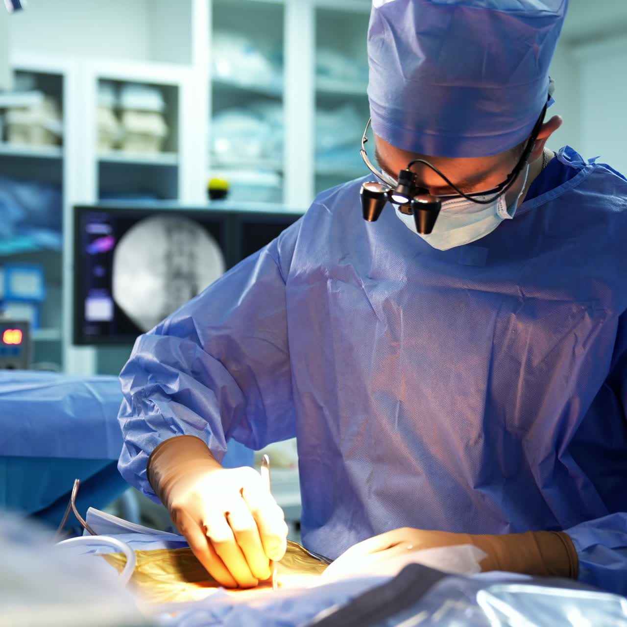Professional surgeon cuts the patient's skin using scalpel. Equipped doctor changes instrument for electric one. Blurred backdrop