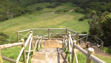 walkway and viewpoint overlooking green fields in terceira island, azores, portugal