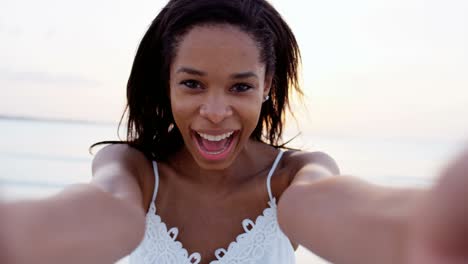 portrait of african american girl on beach vacation