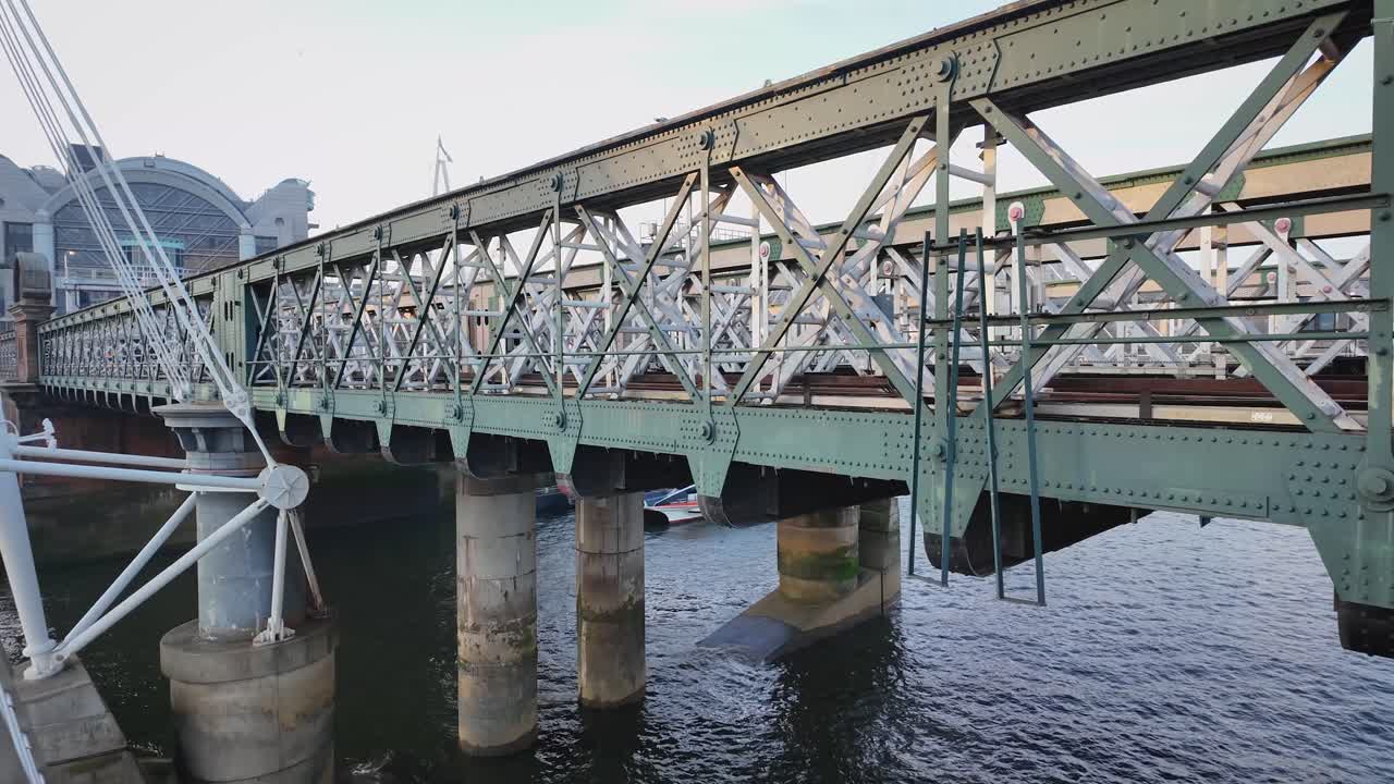 Static shot from the Golden Jubilee Bridges of the Hungerford Bridge over the River Thames in central London, England