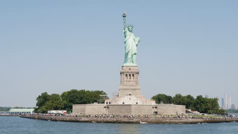 slow motion view of people at statue of liberty icon monument sculpture in new york city manhattan staten island usa america travel tourism hudson river harbour