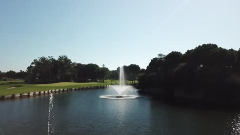 beautiful fountain and vivid grass on golf field in turkey