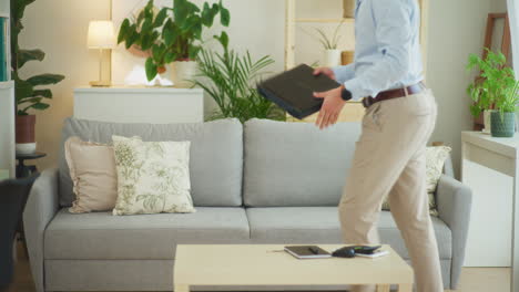 Businessman-Enters-Room-and-Starts-Working