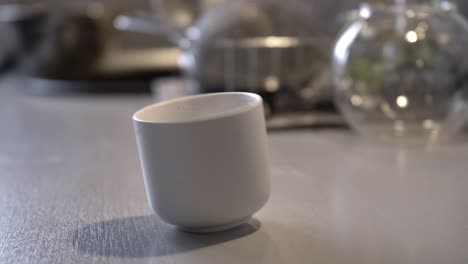 coffee cup spinning around on kitchen table