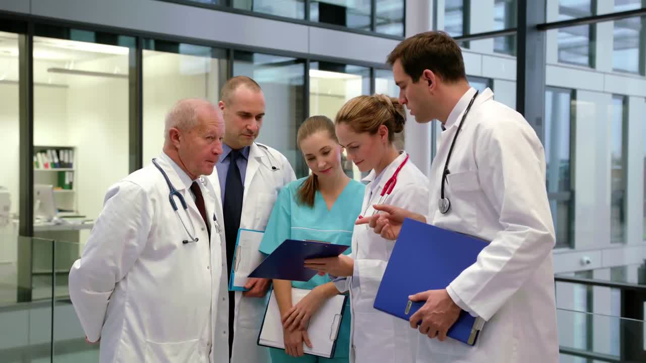 Team of doctors discussing over medical report