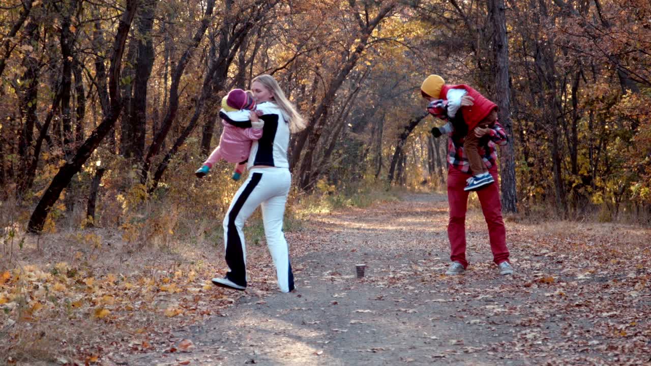 Happy Family Walk in Autumn Park