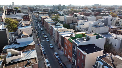 aerial establishing shot of colorful homes in residential urban city in usa