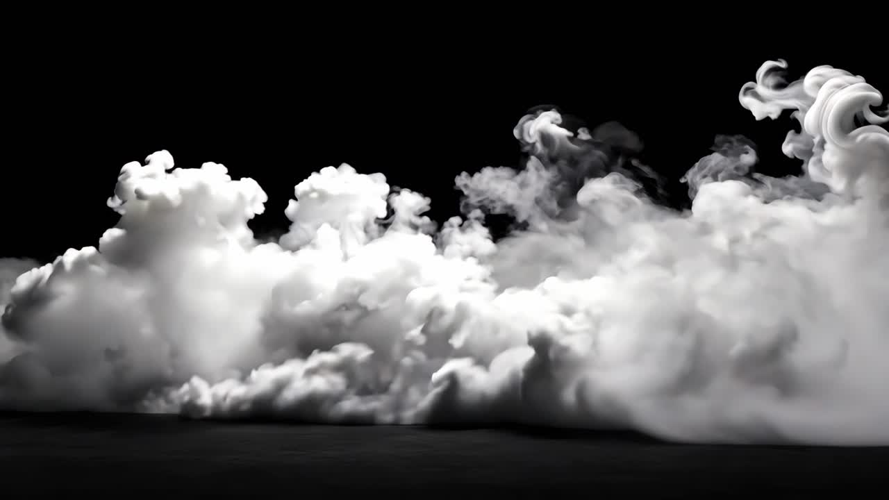 A black and white photo of a cloud of smoke. The smoke is thick and billowing, creating a sense of mystery and intrigue. The image evokes a feeling of uncertainty and unease