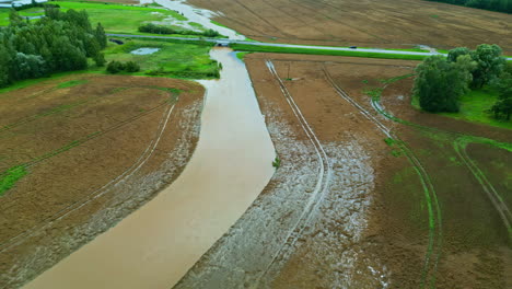 aerial view of agricultural fields and crops flooded by heavy rains