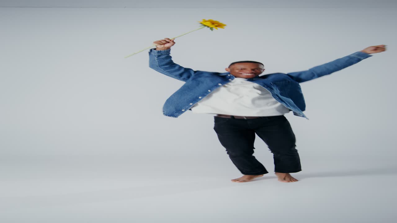 Man Dancing with a Sunflower