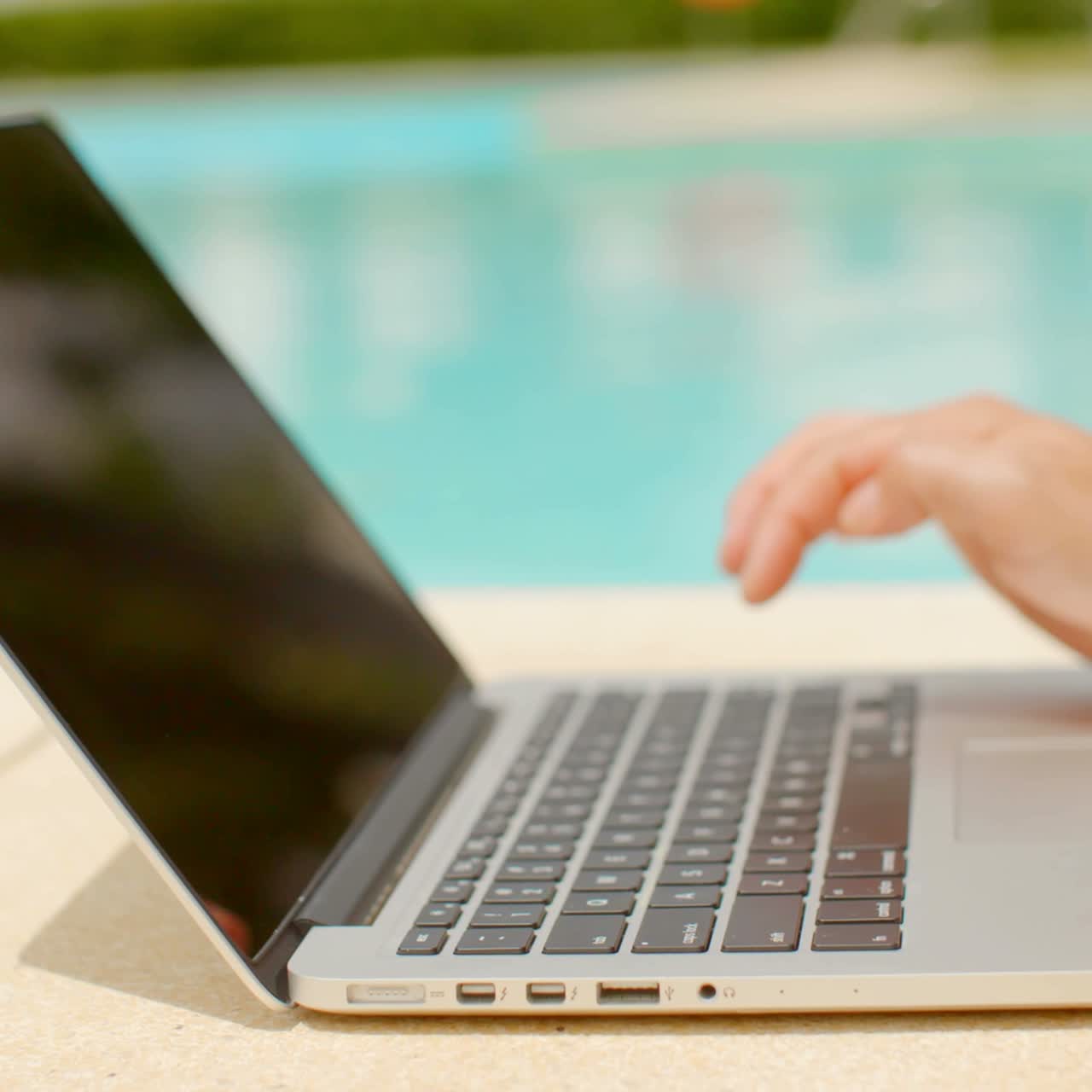 Woman using laptop computer outdoors