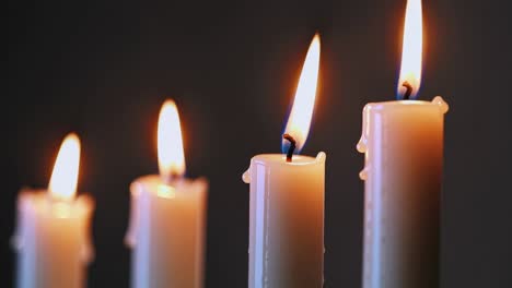 the video captures a serene ambiance with flickering candle flames, emphasizing tranquility