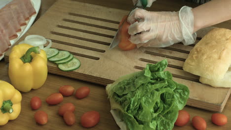 slicing tomatoes into small pieces