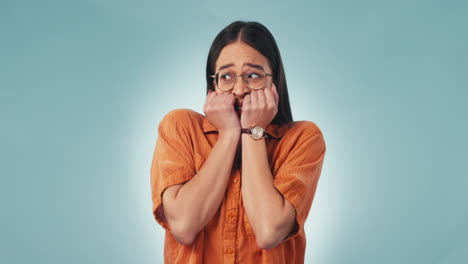 Anxiety,-fear-and-face-of-woman-biting-nails