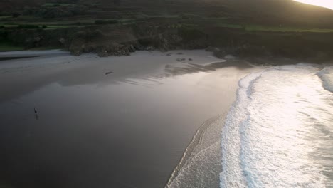 paradise beach with sea waves washing on the shore at sunrise