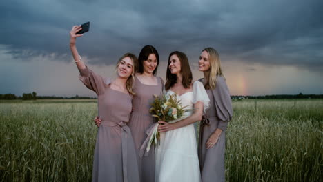 bride posing with her bridesmaids