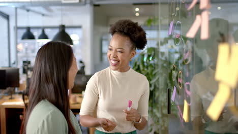 young african american woman engages in a lively business conversation at the office