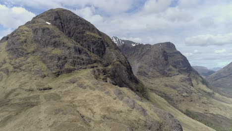 aerial footage of the three sisters mountain range in glencoe, scoottish highlands