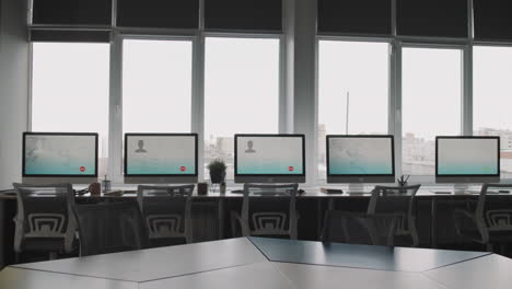 modern office workspace with computers and windows