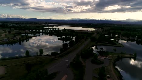 be humbled in awe at this sunset taken by drone of the rocky mountains with reflections in the lakes below