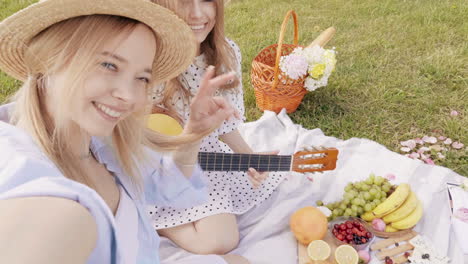 happy friends enjoying a picnic in the park