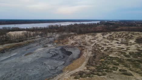 aerial birds eye shot of sand mining area and vistula river in background