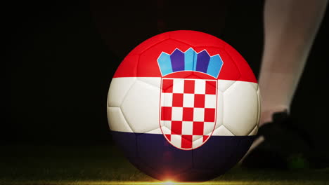 football player kicking croatia flag ball