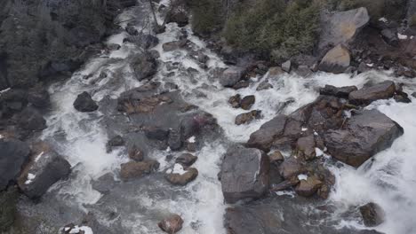 Rushing-water-over-rocks-in-Owen-Sound,-Ontario,-birds-eye-view-of-a-mountain-stream