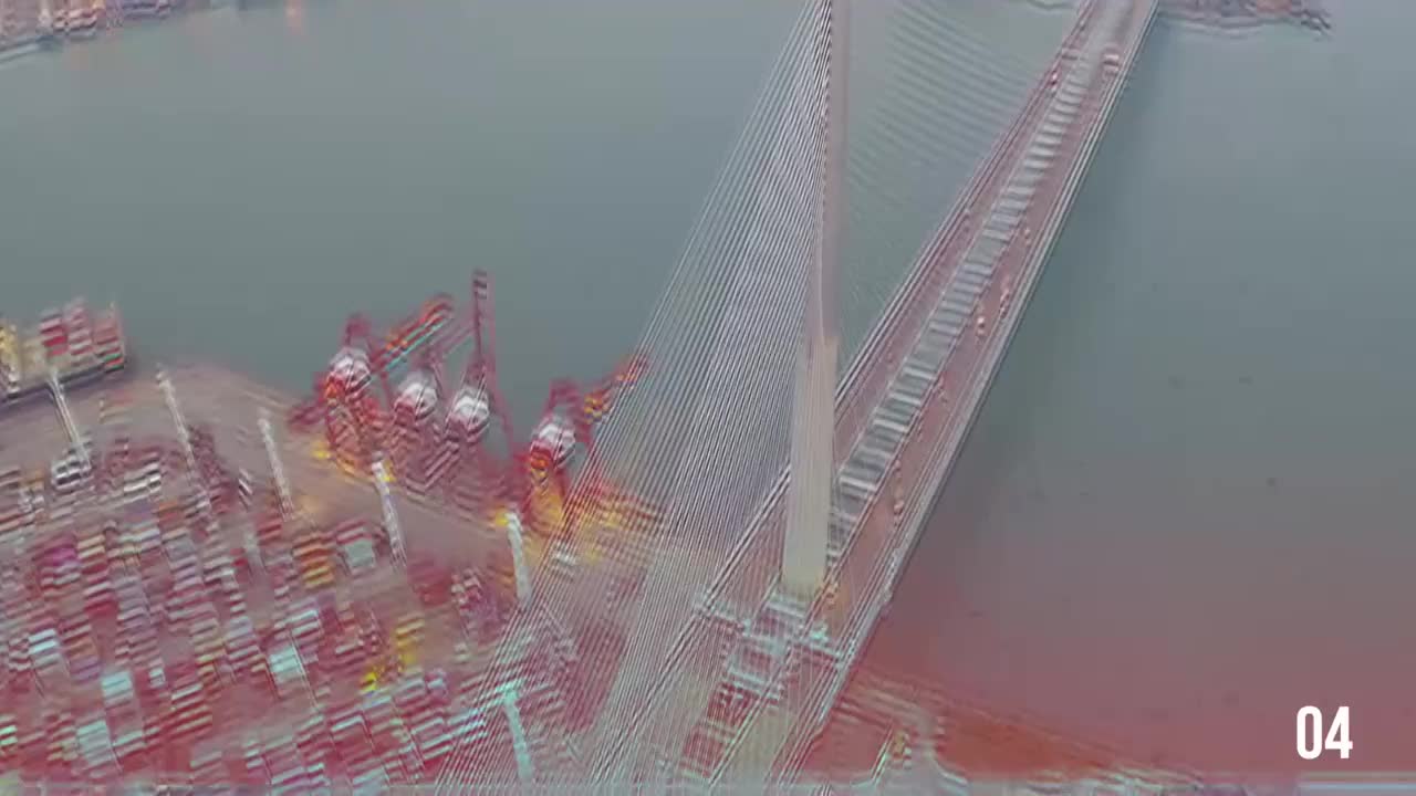 Aerial View of a Cable-Stayed Bridge Over a Port