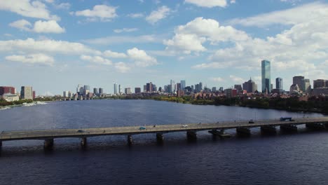 drone flying away from traffic on harvard bridge in boston, massachusetts