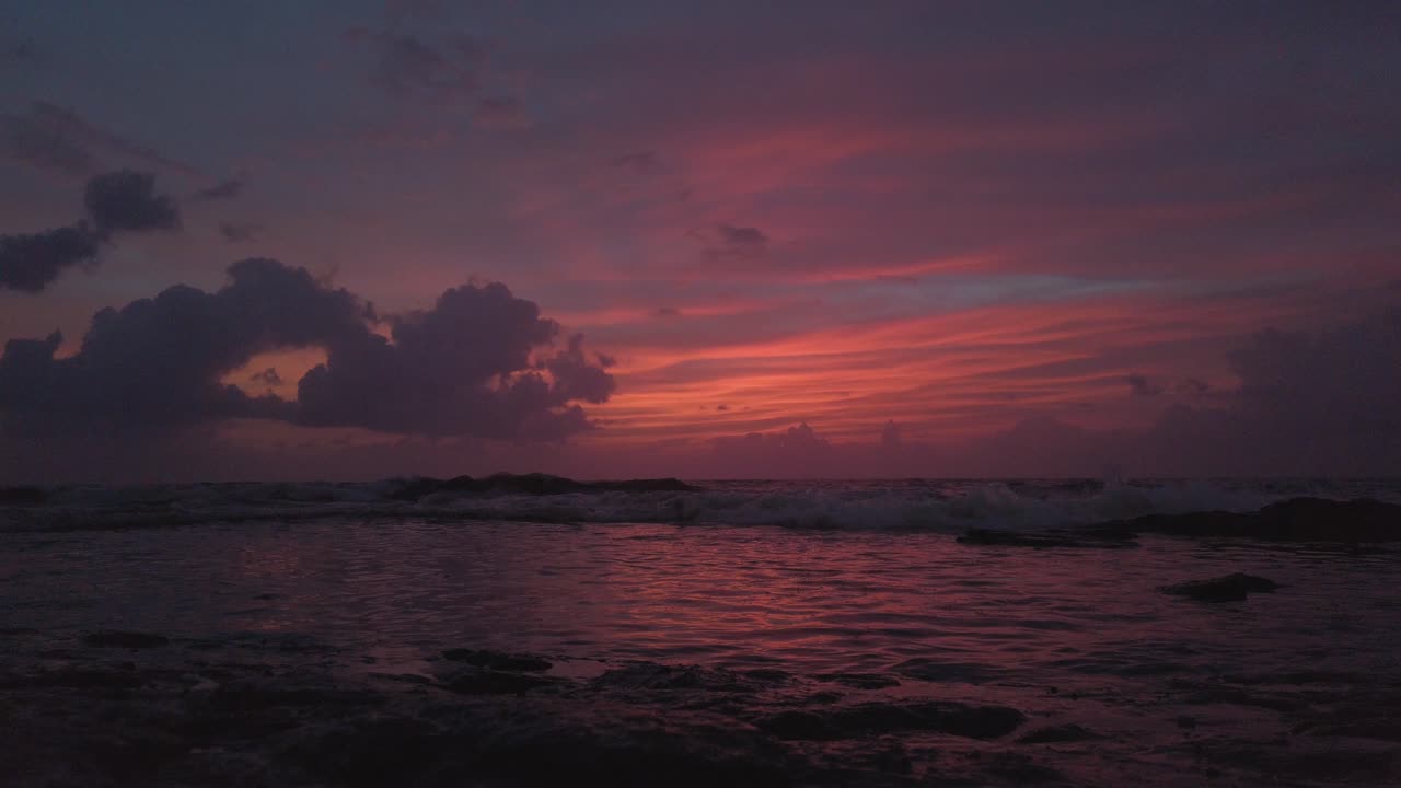 Slow motion waves at sunset