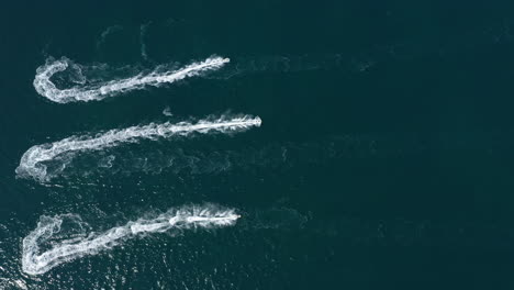 Jet-ski-aerial-top-shot-beautiful-boat-wake-with-light-during-night